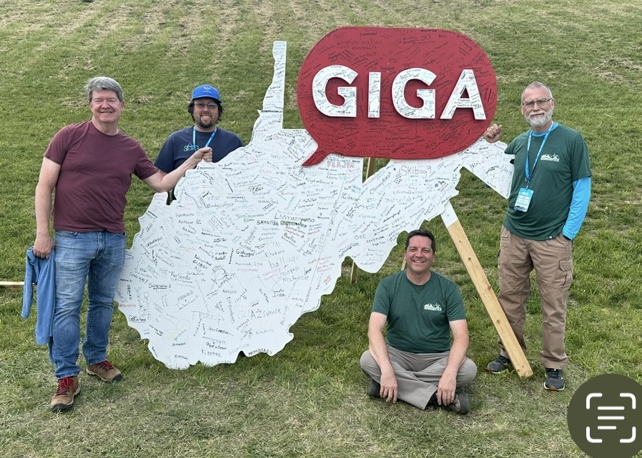 GW_4_men_GIGA_sign.jpg
